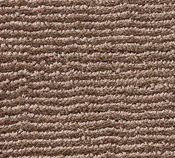 Soft beige carpet with textured loop pattern, ideal for commercial and residential flooring.