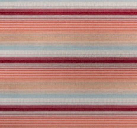 Colorful striped rug with red, peach, and blue tones.