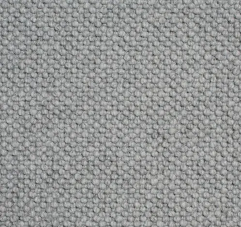 Soft gray textured carpet for residential and commercial flooring.