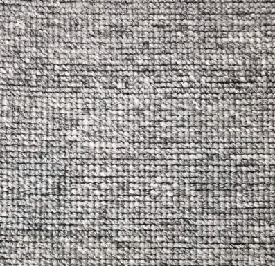 Soft gray textured carpet for home and commercial flooring solutions.
