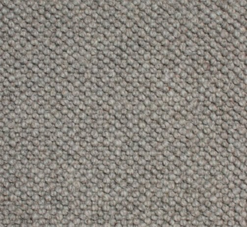 Beige carpet flooring close-up, textured commercial and residential carpet for home decor.