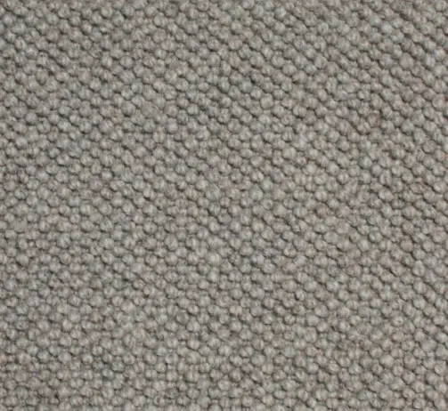 Beige carpet flooring close-up, textured commercial and residential carpet for home decor.