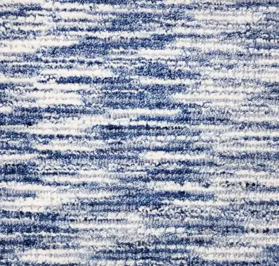 Soft blue and white textured area rug showcasing premium carpet flooring.