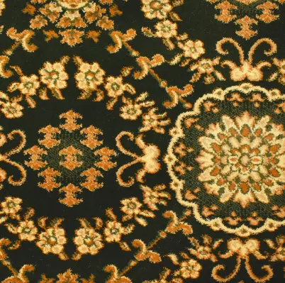 Intricate black and gold Persian-style area rug with floral patterns for luxurious home decor.