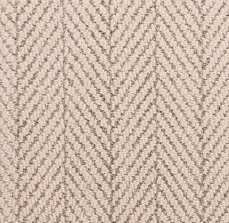 Soft beige herringbone carpet flooring in a modern residential interior.