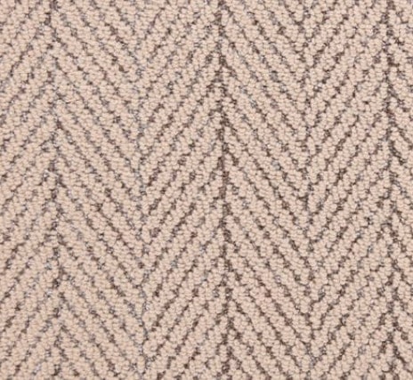 Warm beige herringbone carpet for residential and commercial flooring installations.