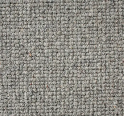 Soft beige carpet with textured woven pattern, ideal for residential and commercial flooring solutions.