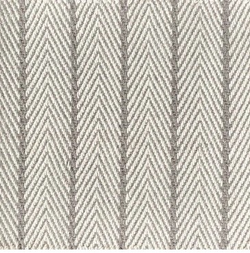 Natural fiber patterned area rug with neutral tones.