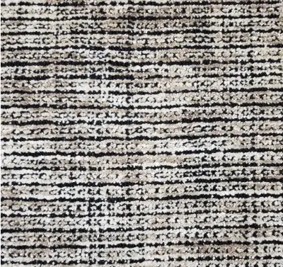 Soft textured area rug with black and beige tones, ideal for modern living spaces.
