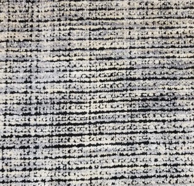 Soft textured carpet with neutral tones, ideal for modern interiors and professional spaces.