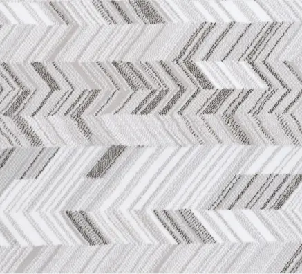 Soft gray and white chevron-patterned area rug for modern interior decor.
