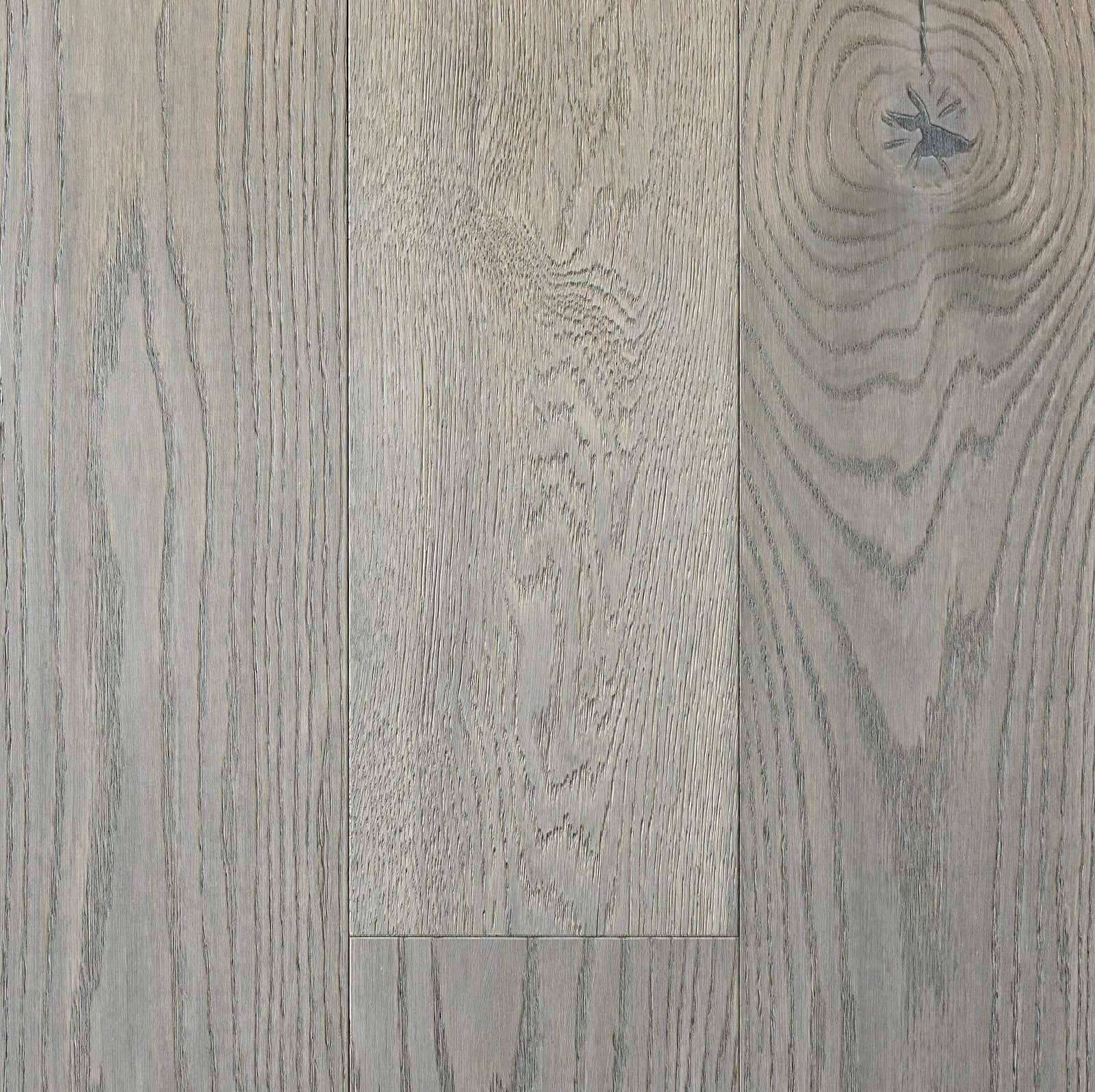 Smooth gray wood flooring with natural grain pattern and finish, ideal for residential and commercial spaces.