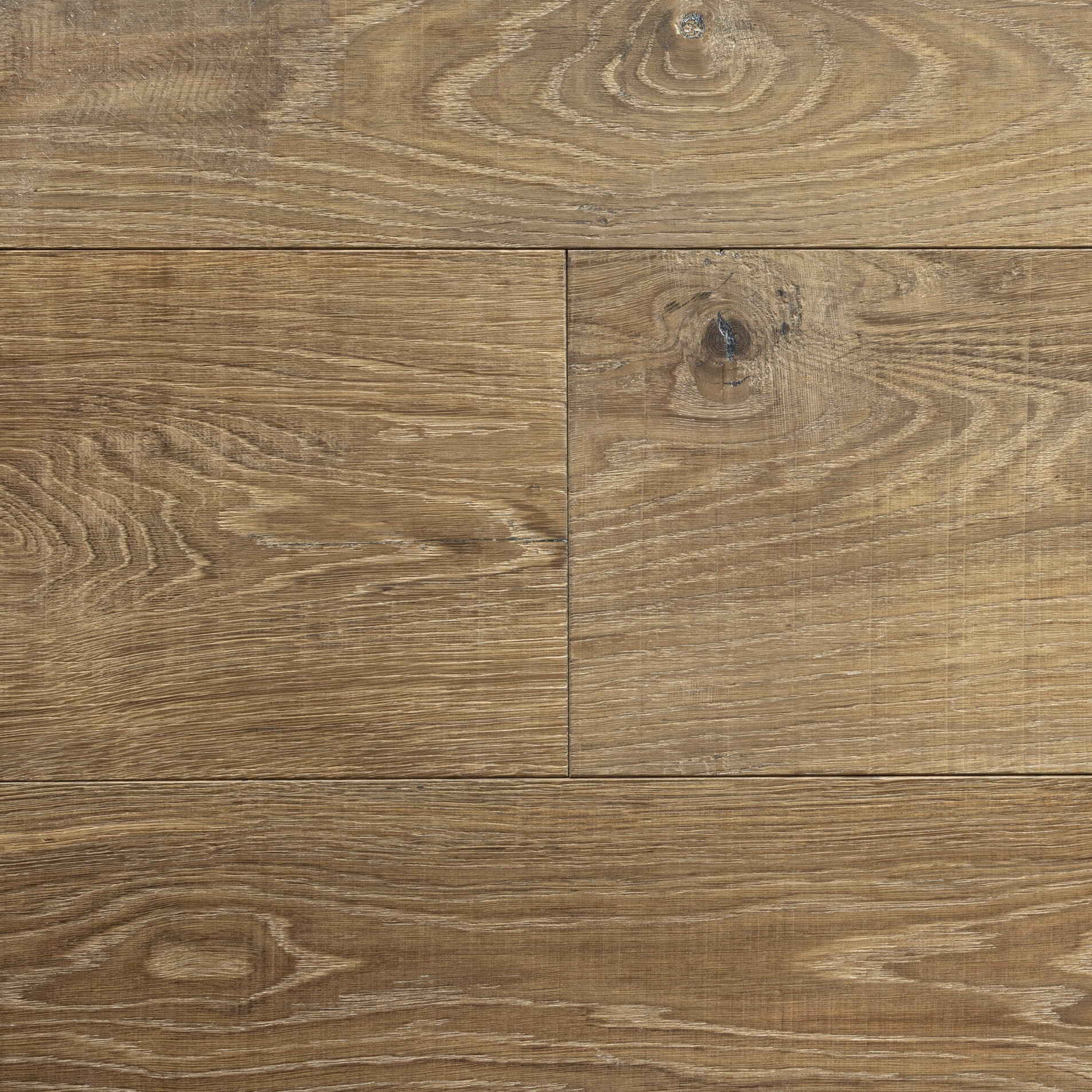 Oak hardwood flooring with natural wood grain finish, ideal for residential and commercial spaces.
