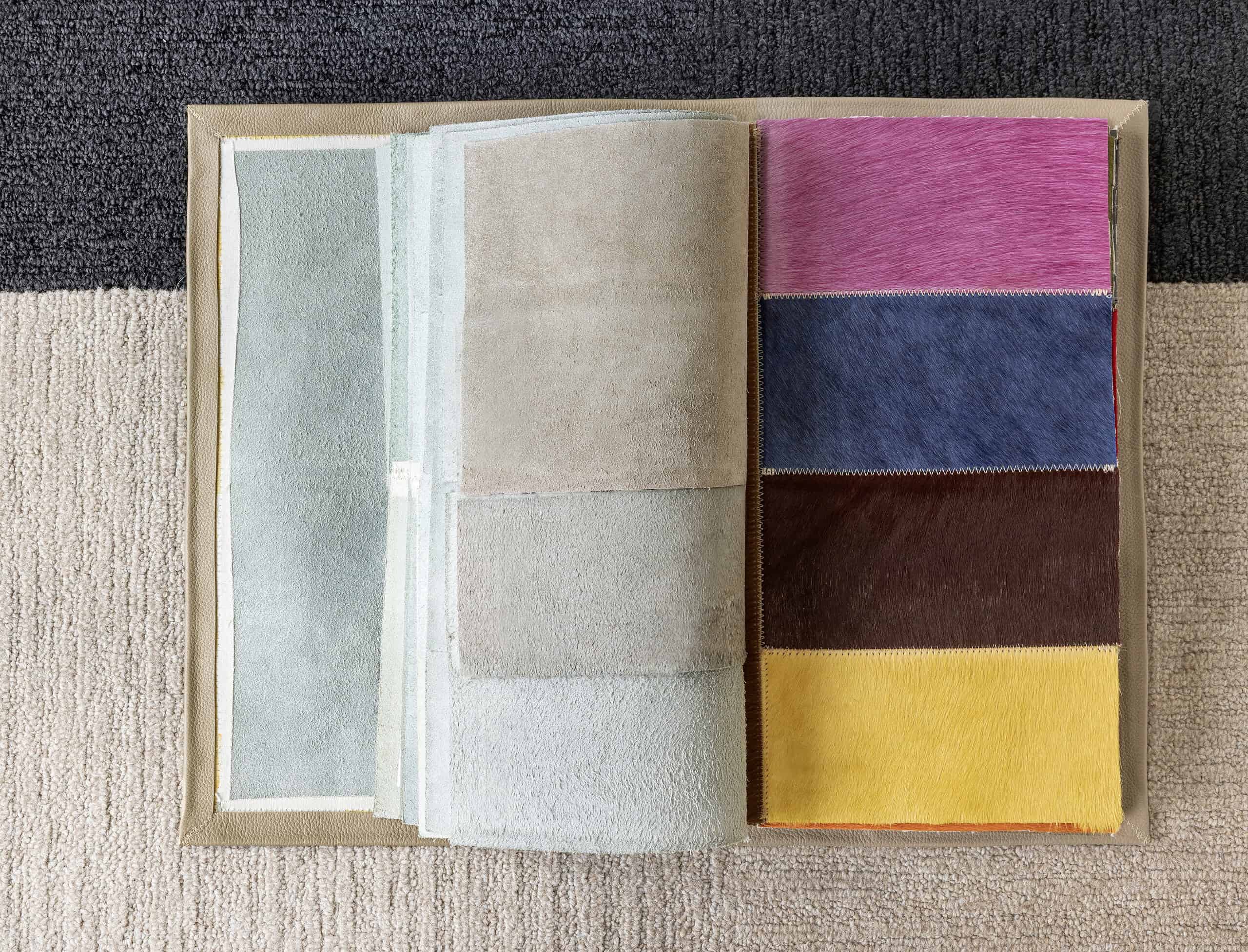 Color palette of carpet samples and interior flooring options from Creative Floors, ideal for home renovation projects.