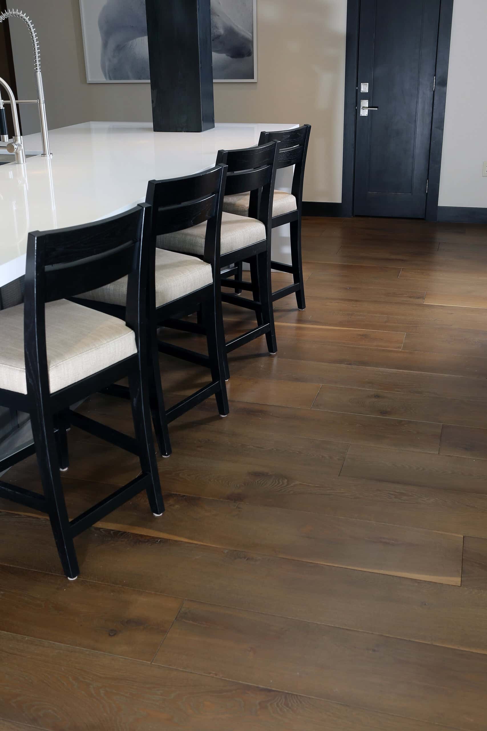 Sustainable hardwood flooring with a rich, warm finish in a modern kitchen setting.
