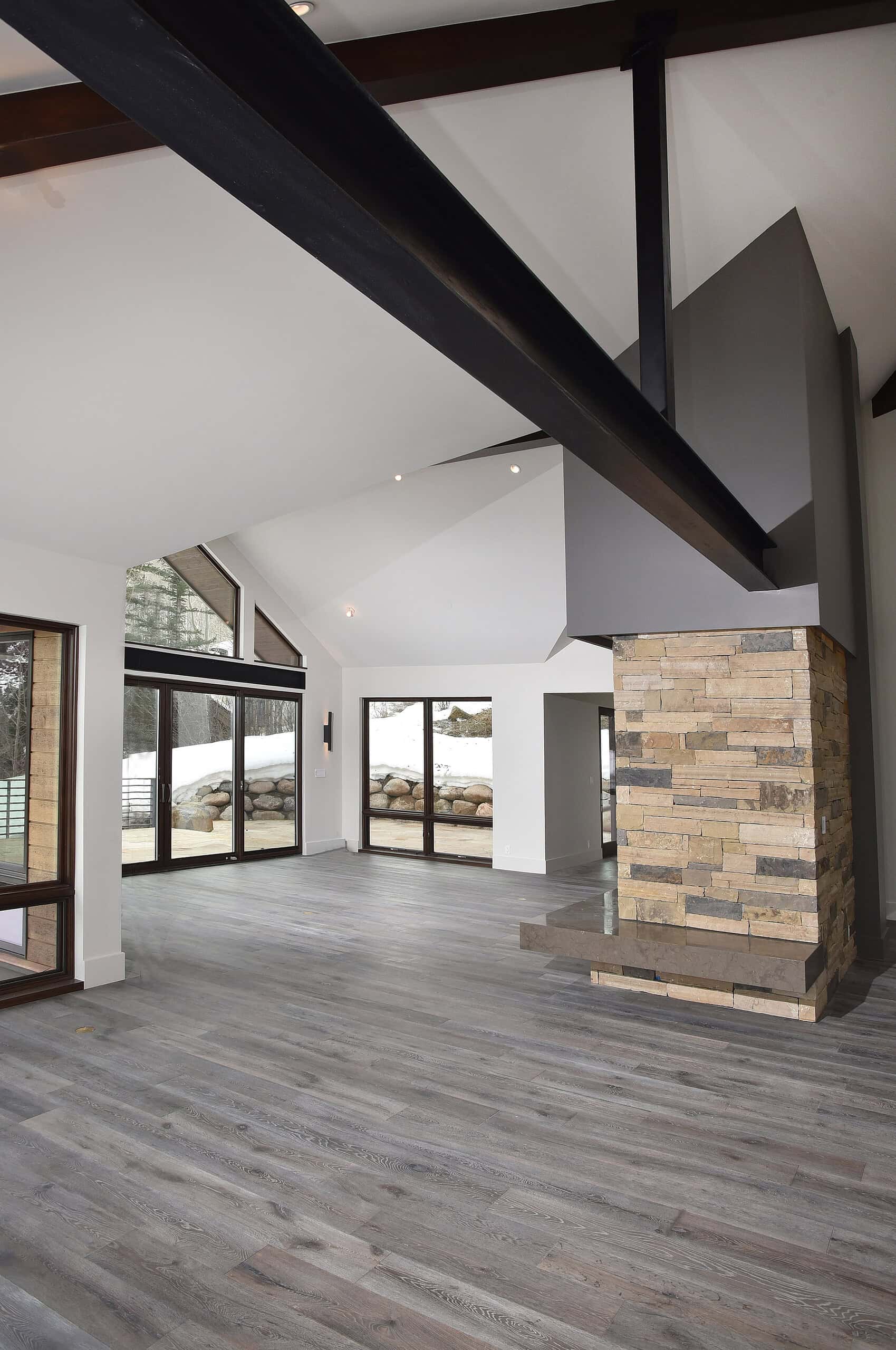 Smooth gray post laminate flooring in modern mountain home interior.