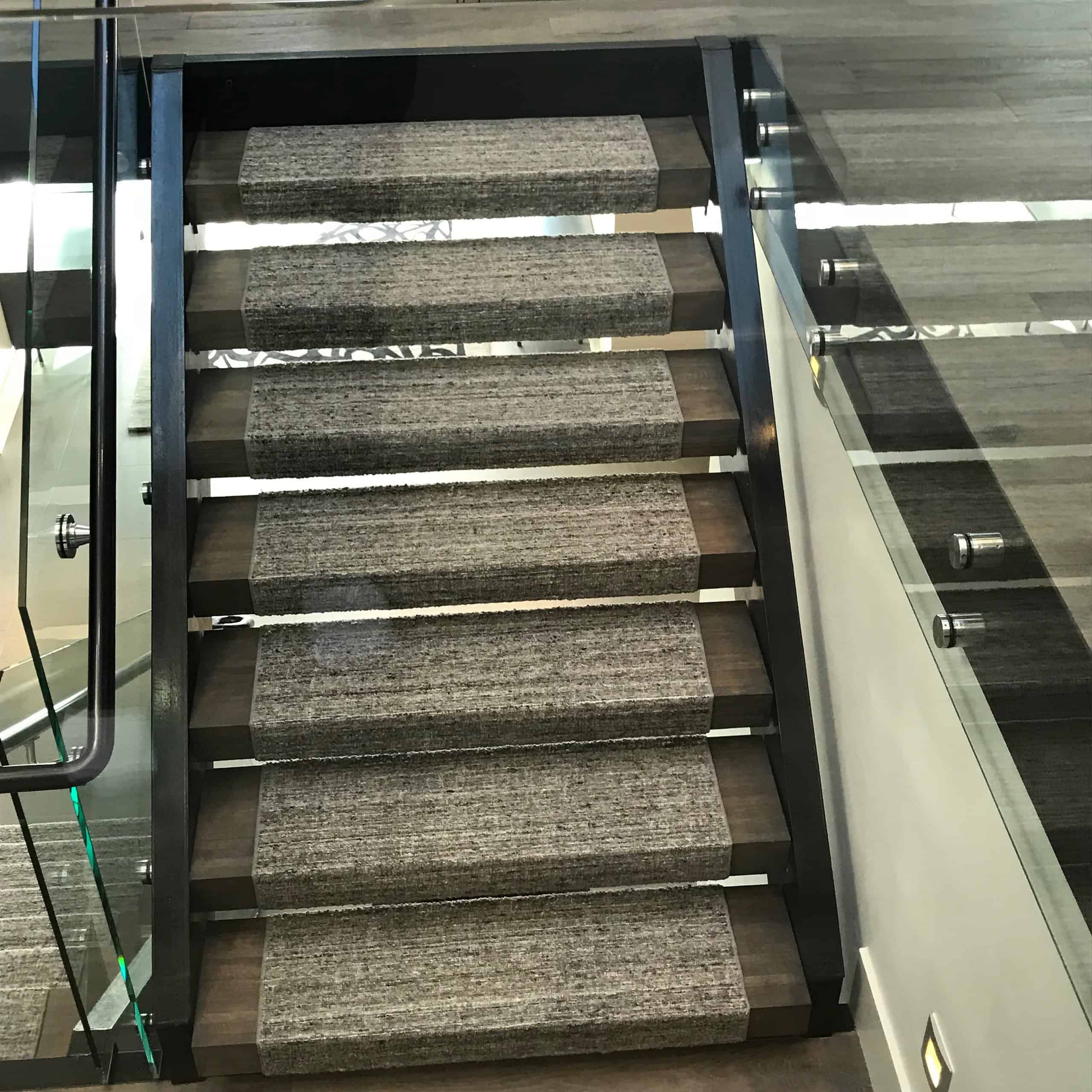 Floating staircase with runner carpet