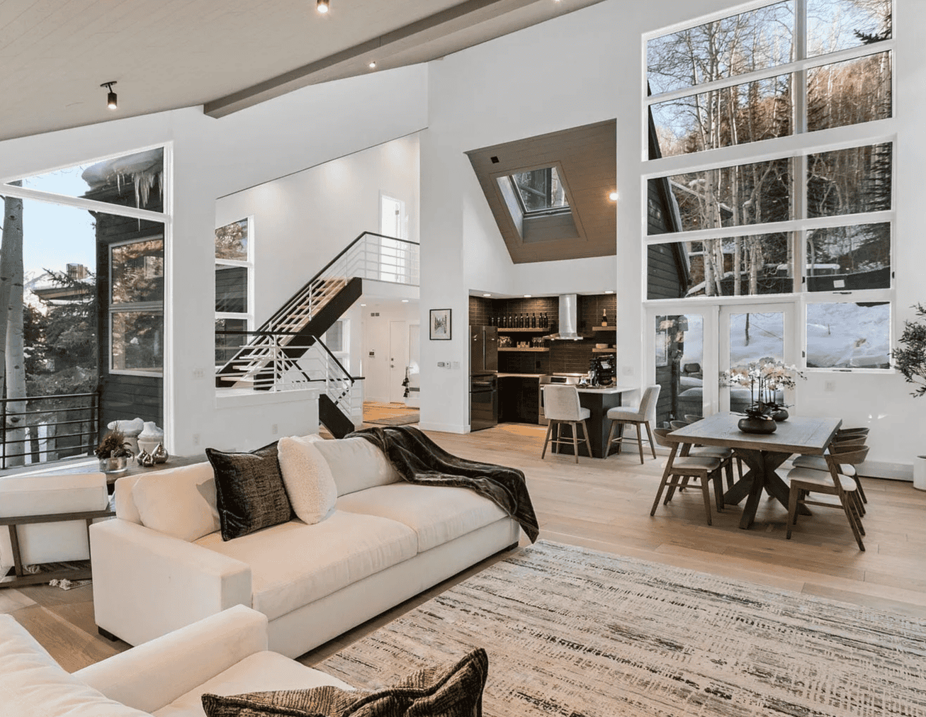 Engineered hardwood flooring inside modern mountain home interior living room.