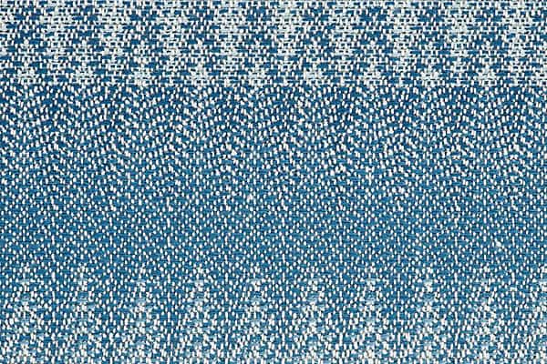 Vibrant blue textured carpet with modern design for residential or commercial floors.
