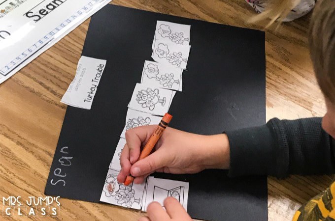 A student is coloring a picture of a turkey on an individual retelling activity