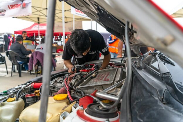 Professional engine check-up during vehicle service.