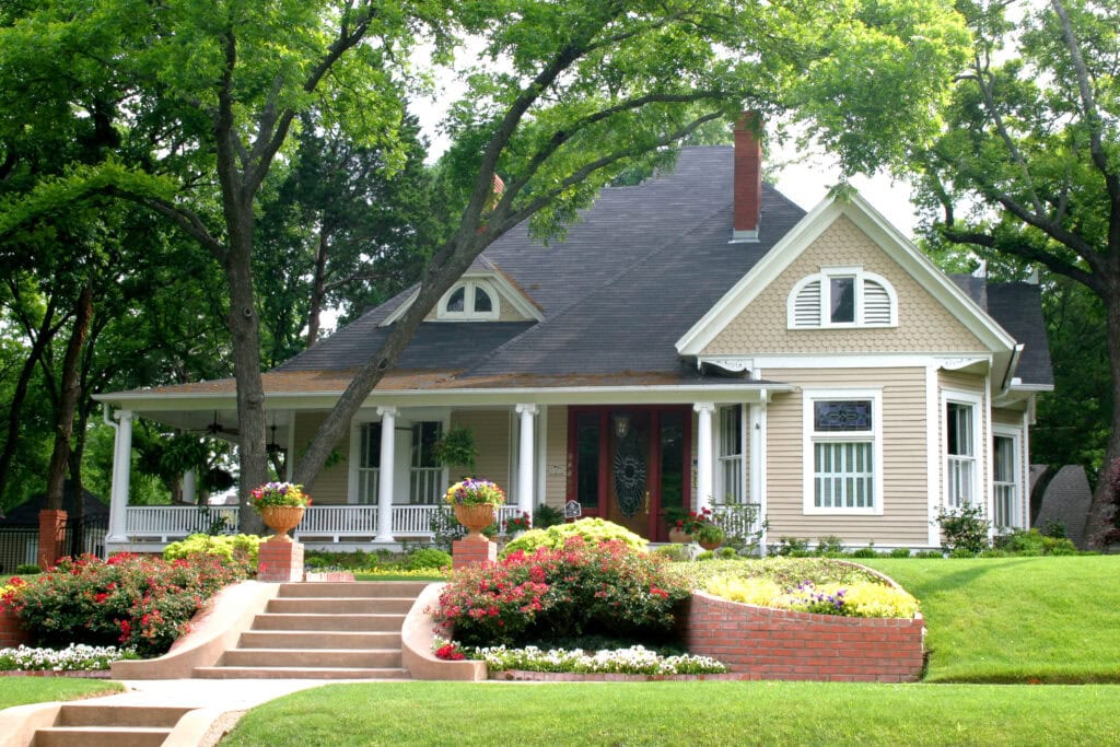 An image that shows Classic House With Flower Garden