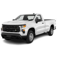 White Chevrolet Silverado truck at Denny's Automotive & Muffler Center.