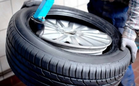Tire replacement service at Denny's Automotive & Muffler Center.