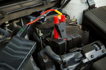 Engine battery and electrical system repair in progress at Dettwiler Brothers Repair, specializing i.