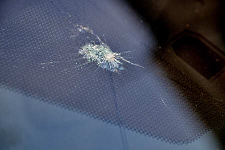 Cracked car windshield repaired by Dettwiler Brothers Repair, auto glass service.