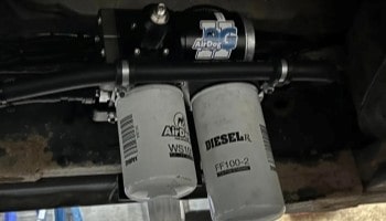 Close-up of diesel fuel filters and injection system in a vehicle.