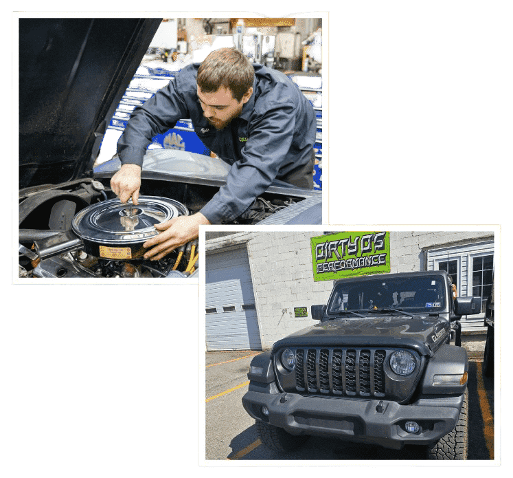 Technician working on car engine at Dirty D’s Performance shop.
