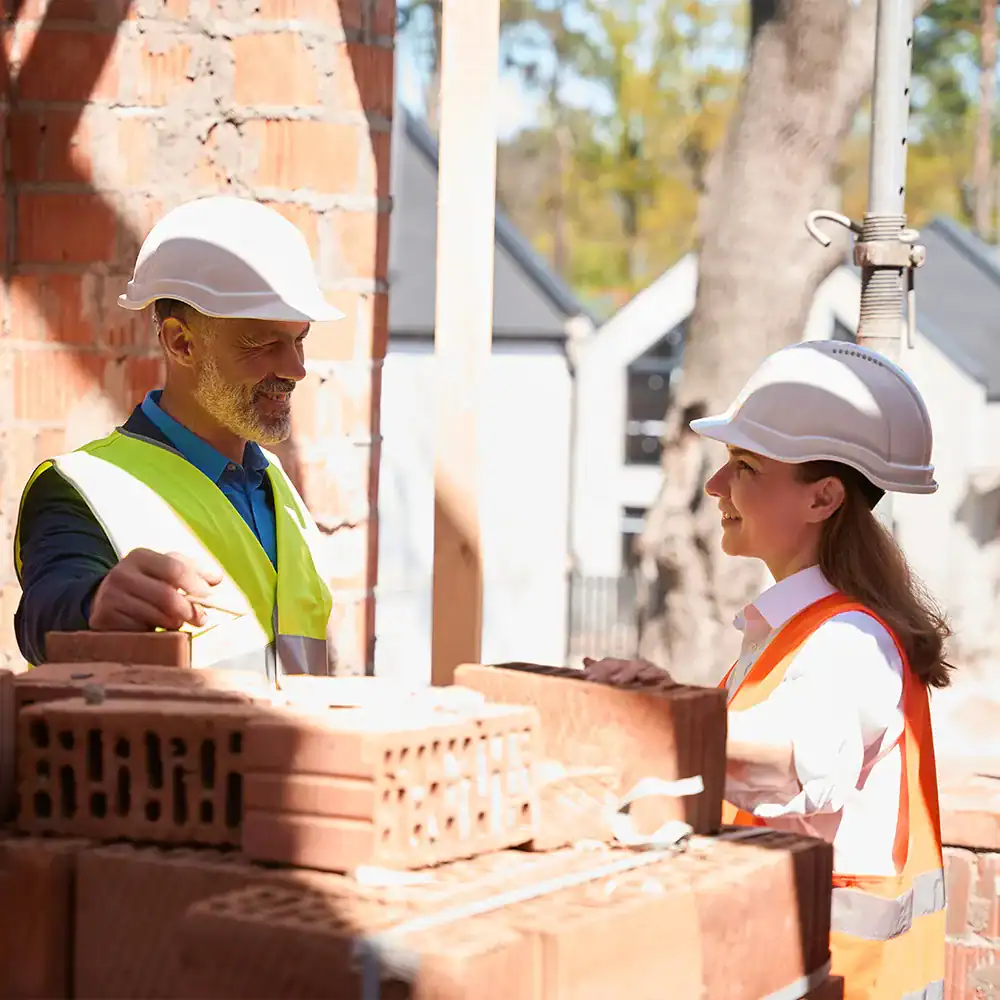 Construction crew chatting | Divine Construction Operations Inc.