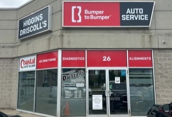 Exterior view of Higgins Driscoll’s Automotive shop with signage and entrance.