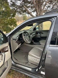 Auto Care Clinic interior with steering wheel and dashboard.