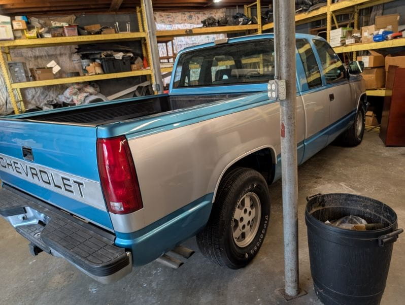 Chevrolet pickup truck inside DrivenMotos auto care clinic for maintenance or repair.