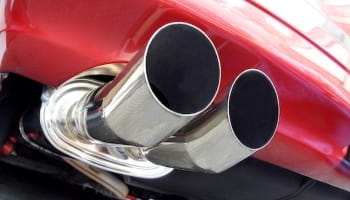 Exhaust pipes of a sports car at DrivenMotos Auto Care Clinic.