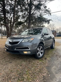SUV parked outdoors at DrivenMotos Auto Care Clinic.