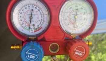 Refrigerant manifold gauge set for automotive AC service and maintenance.