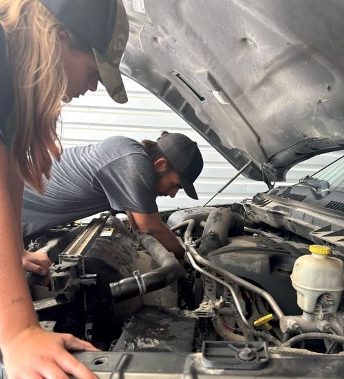 Automotive engine diagnostics and maintenance by skilled technicians.
