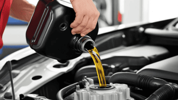 Auto diesel engine oil being poured during maintenance.