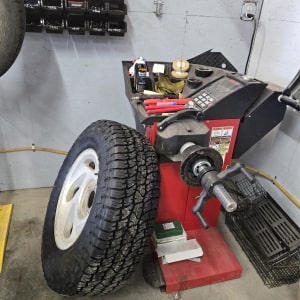 Auto tire and diesel service equipment with tools and machinery.
