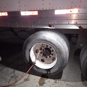 Tire being inspected or repaired on a commercial truck at ER Auto.