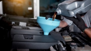 Auto engine oil change at Express Tire & Auto Service.