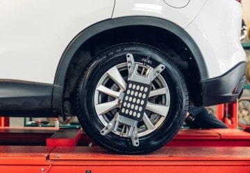 Car wheel being repaired at Express Tire And Auto Service.