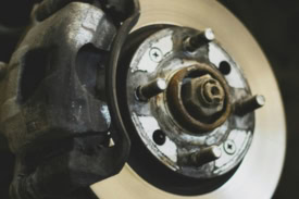 Brake rotor and caliper at Fedora Tire & Oil LLC.