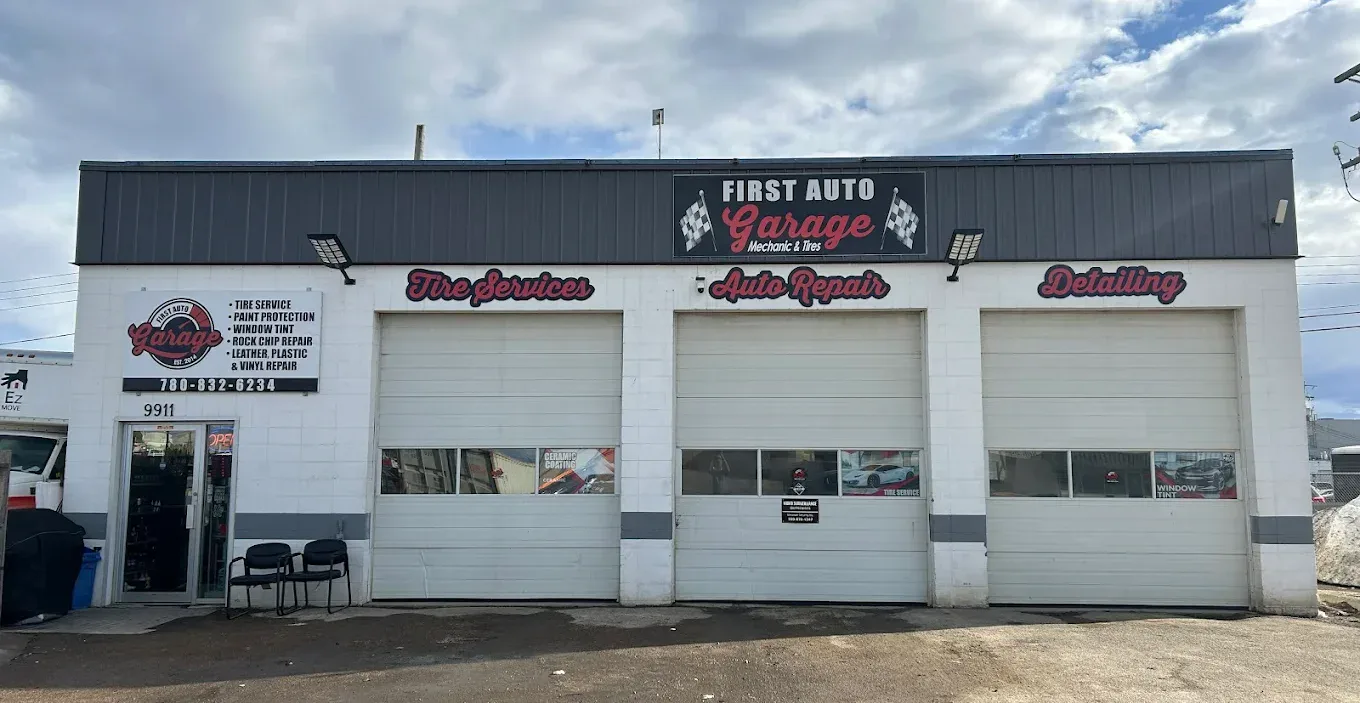 Front view of First Auto Garage auto repair shop with three service bays.