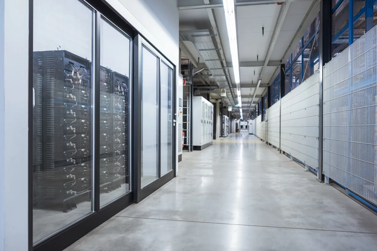 High-tech data center with server racks and cooling systems for optimal performance.