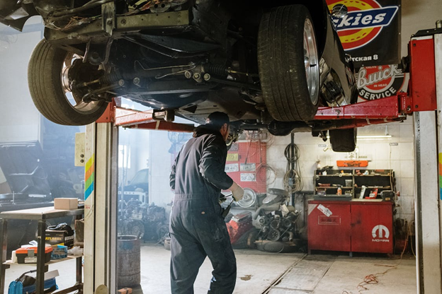 Auto repair shop lifting vehicle for brake system maintenance and diagnostics.