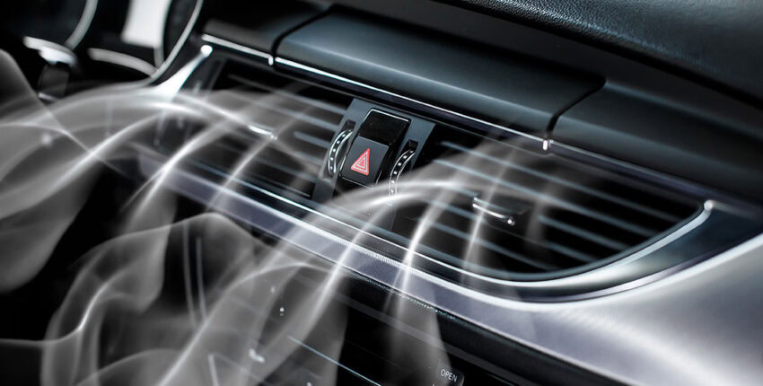 Car dashboard with airflow indicating heating system in winter preparation.